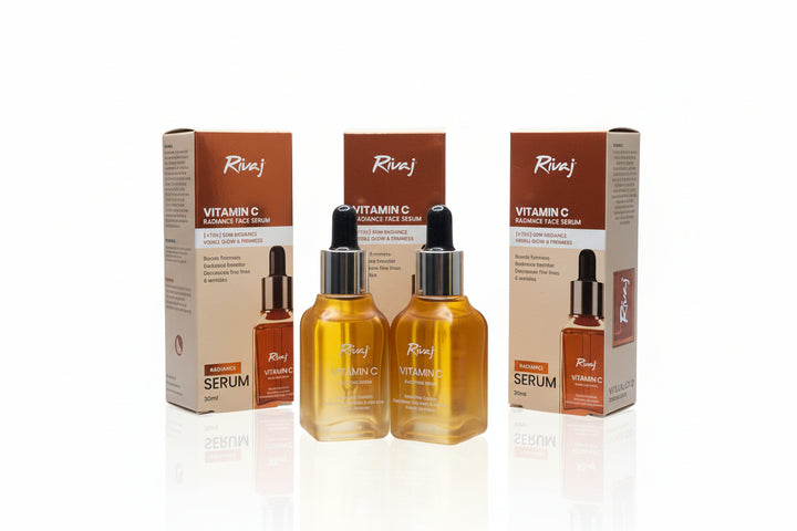 Two bottles of Rivaj Vitamin C serum with their boxes on a white background